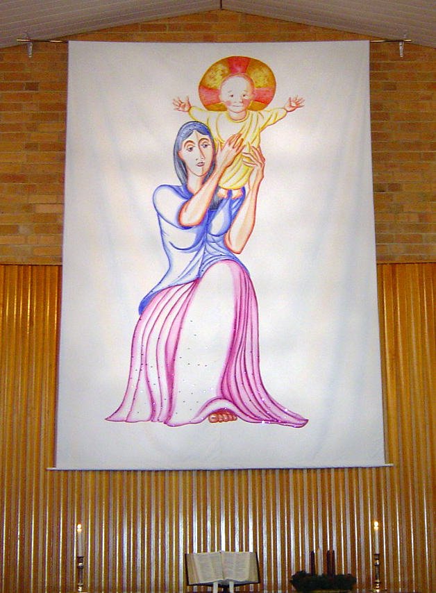 Advent Banner showing Mary holding her baby son, Jesus, high up before her.
